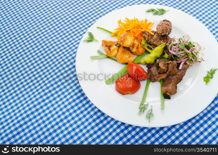 Plate with tasty lamp kebabs