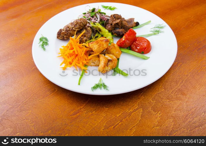 Plate with tasty lamp kebabs