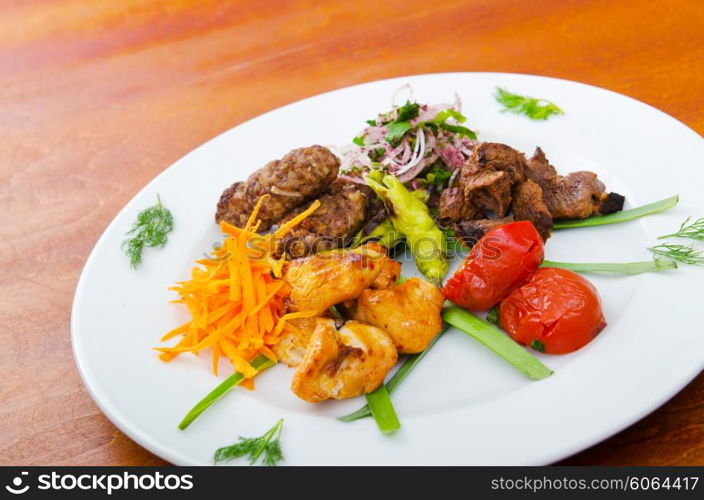 Plate with tasty lamp kebabs