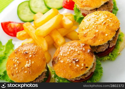 Plate with tasty mini burgers