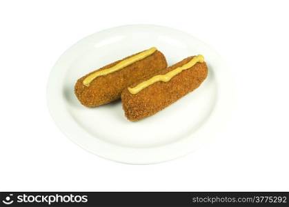 Plate with two beef croquettes with mustard on a white background.