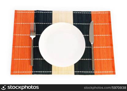 Plate with utensils isolated on the white