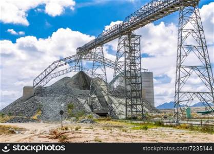 Platinum Mining and Processing of ore, Piles of ore rock being moved and stored