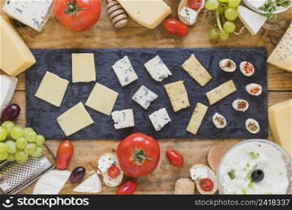 platter cheese slice black slate board table