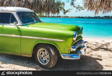 Playa La Herradura, Cuba - October 27, 2019  American classic car on the beach Playa La Herradura, Province Las Tunas, Cuba