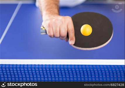 Player in a Ping pong tournament playing a game