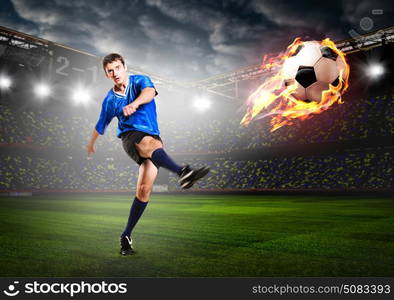 player is kicking ball. soccer or football player is kicking ball on stadium