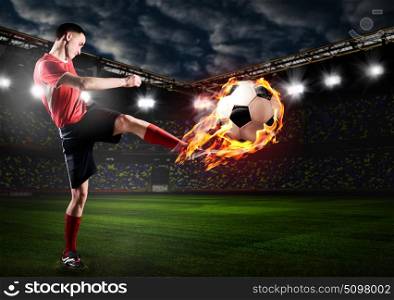 player is kicking ball. soccer or football player is kicking ball on stadium