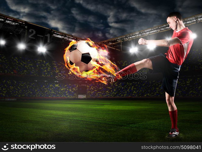 player is kicking ball. soccer or football player is kicking ball on stadium