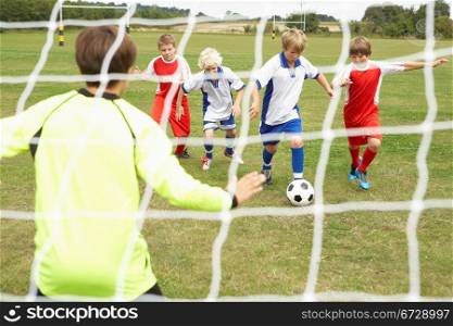 Player ready to score goal in Junior 5 a side