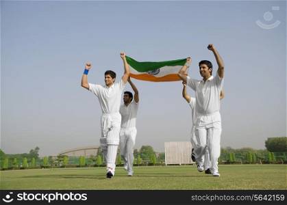 Players holding the national flag