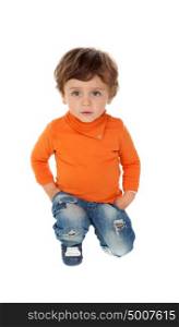 Playful baby on knees with orange jersey isolated on a white background