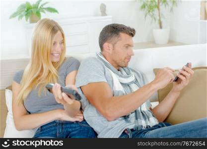 Playful couple on a sofa