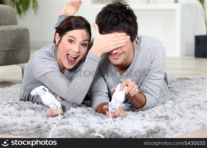 Playful couple with video games