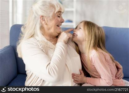 playful grandma with girl