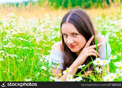playful look girls in camomile field