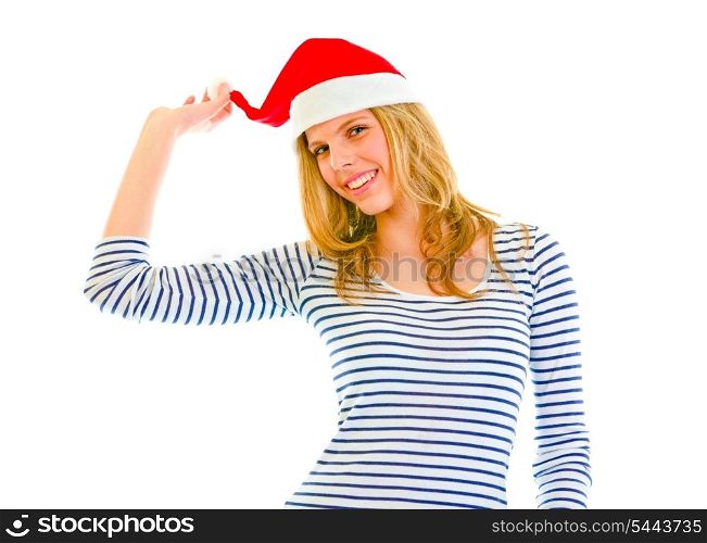 Playful lovely teen girl in Santa hat isolated on white &#xA;