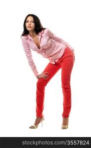 Playful young brunette in red jeans. Isolated
