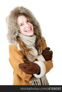 Playful young woman in winter coat on white background