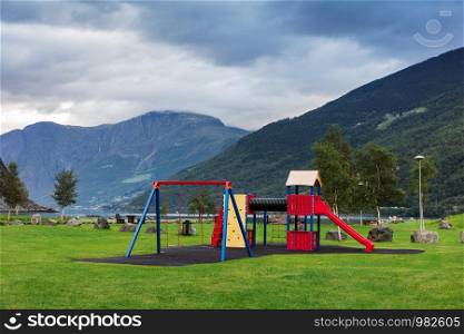 playground in the park on the shore of the fjord, Norway