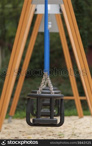 Playground with empty swings for kindergarten children
