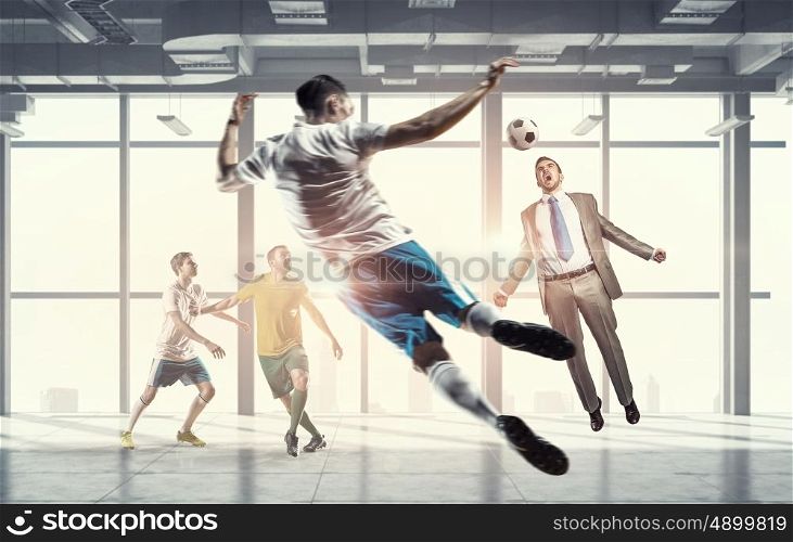 Playing ball in office. Players and businessman playing soccer ball in modern office