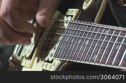 playing electric guitar