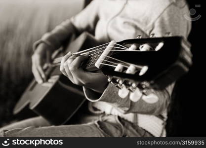 Playing guitar