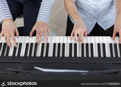 playing the piano four hands