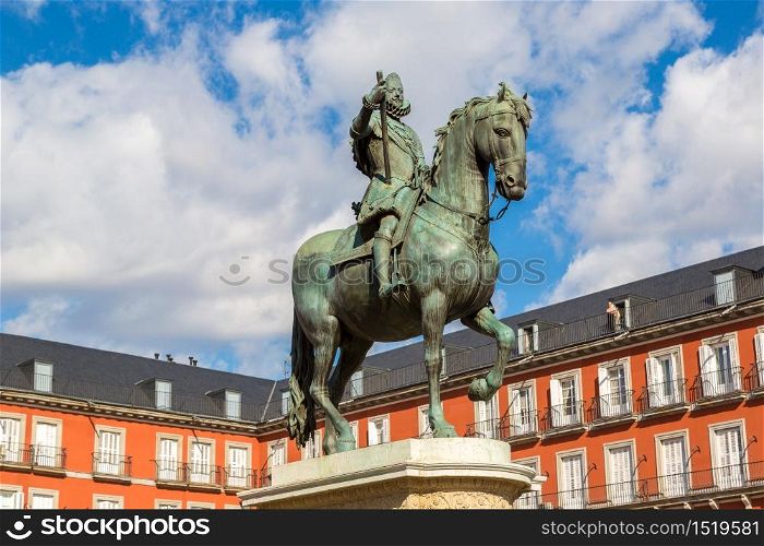 Plaza Mayor and statue of King Philips III in Madrid, Spain in a beautiful summer day