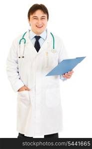 Pleased doctor holding medical chart in hand isolated on white&#xA;