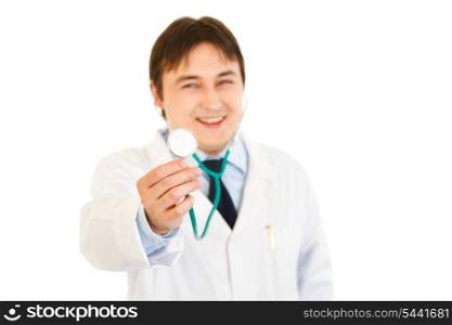 Pleased medical doctor holding up stethoscope isolated on white. Close-up.&#xA;