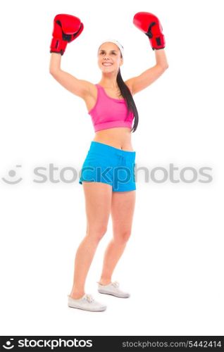 Pleased young fit girl in boxing gloves holding hands raised up isolated on white&#xA;