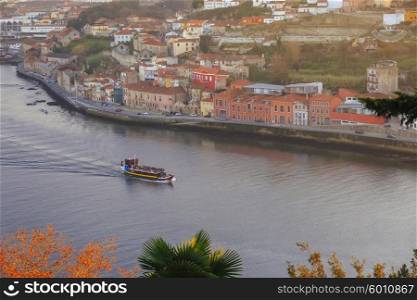 Pleasure boat sailing Douro river in Porto, Portugal&#xA;