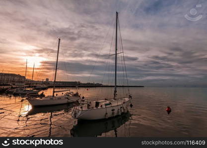 Pleasure boats moored in harbor at sunset. Trieste Italy