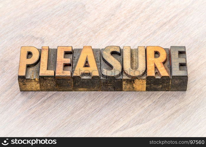 pleasure word abstract in vintage letterpress wood type