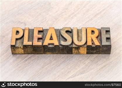 pleasure word abstract in vintage letterpress wood type