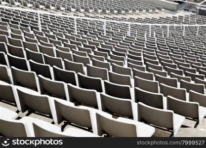 Plenty of plastic seats at large stadium