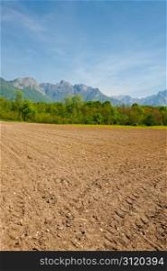 Plowed Fields in the Foothills of Italian Alps