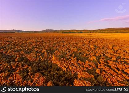 Plowed Fields of Italy in a Autumn at Sunset