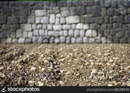 Plowed ground and stone wall