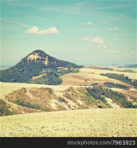 Plowed Sloping Autumn Field in Tuscany on the Background of Green Hill, Italy, Instagram Effect