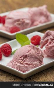 plum ice cream with raspberries