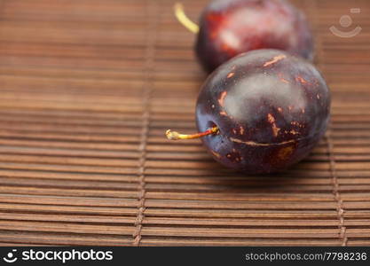 Plum on a bamboo mat