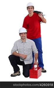 Plumber and electrician working as team