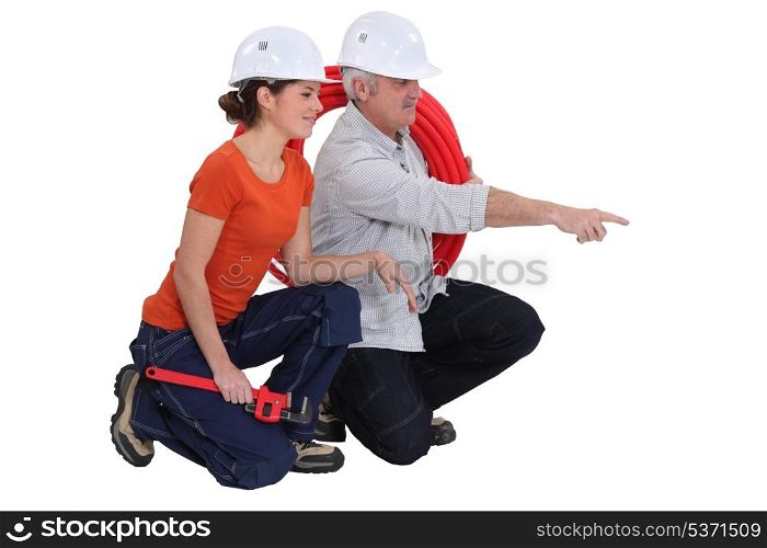 Plumber and female apprentice