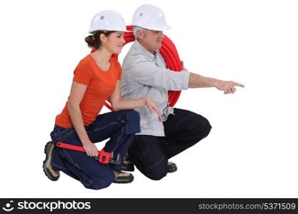 Plumber and female apprentice