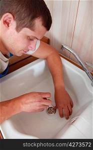 Plumber fitting a kitchen sink