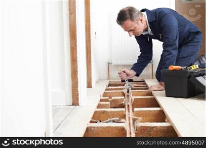 Plumber Fitting Central Heating System In House