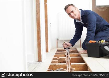 Plumber Fitting Central Heating System In House